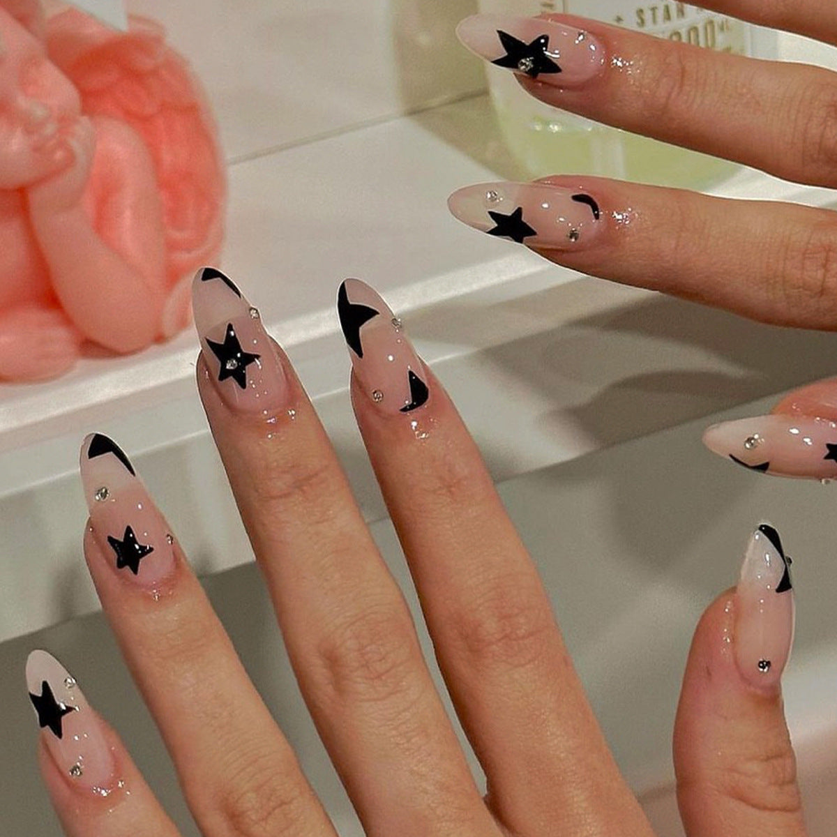 Rhinestone stars adorn the manicure